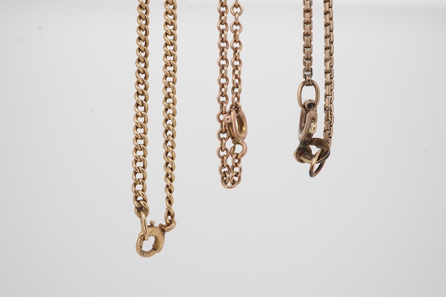 A 14k chain, 40cm, with a 9ct 'Imp' drop pendant, 47mm, together with a 9ct chain and a 9ct cross pendant on a yellow metal chain. Condition - poor to fair